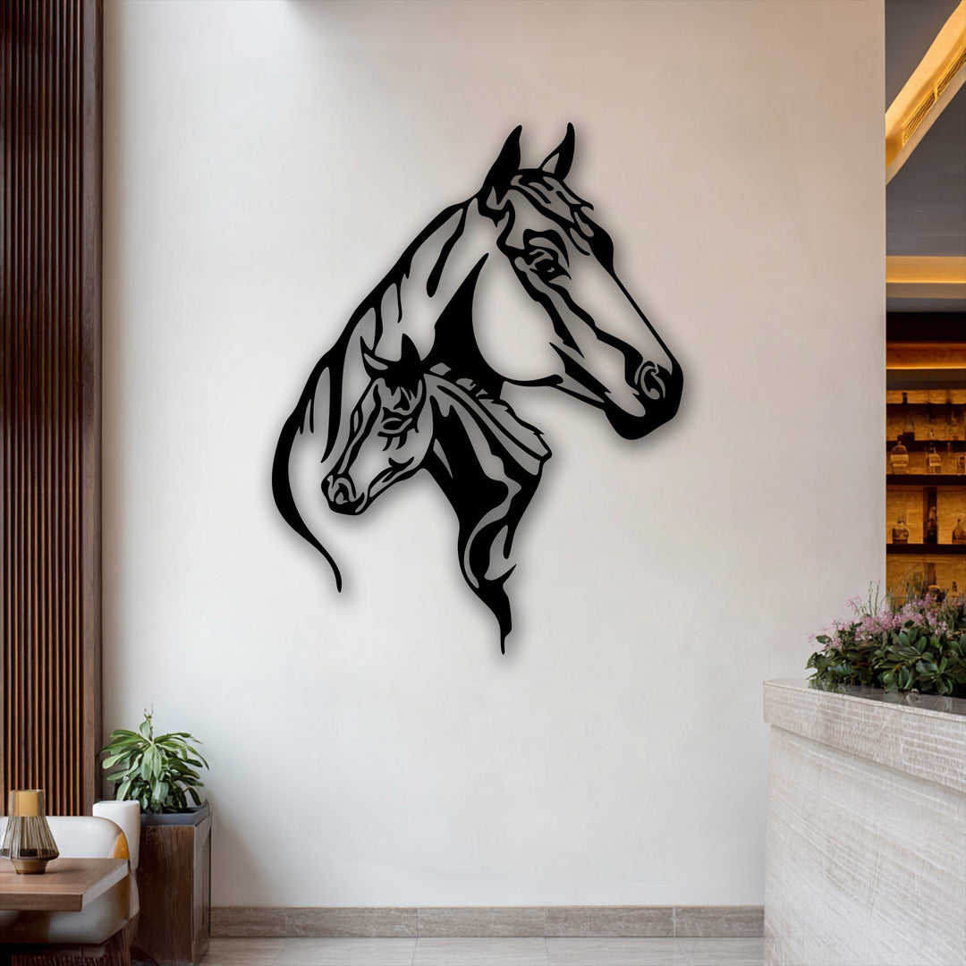 The matte black finish of this elegant dual horse head silhouette metal art for wall dramatically stands out against the white wall.