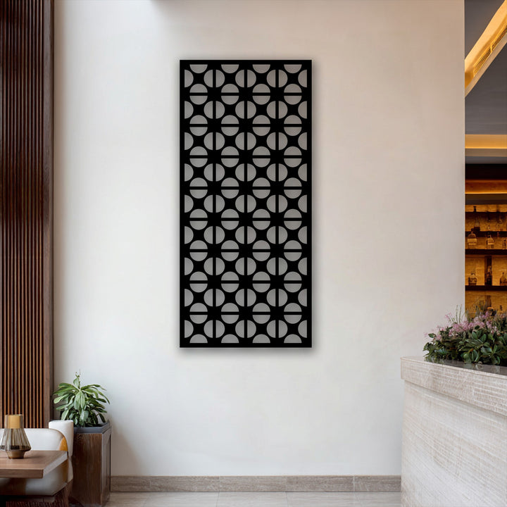Abstract black geometric circle pattern metal wall art creates a captivating decoration wall art statement on a white wall.