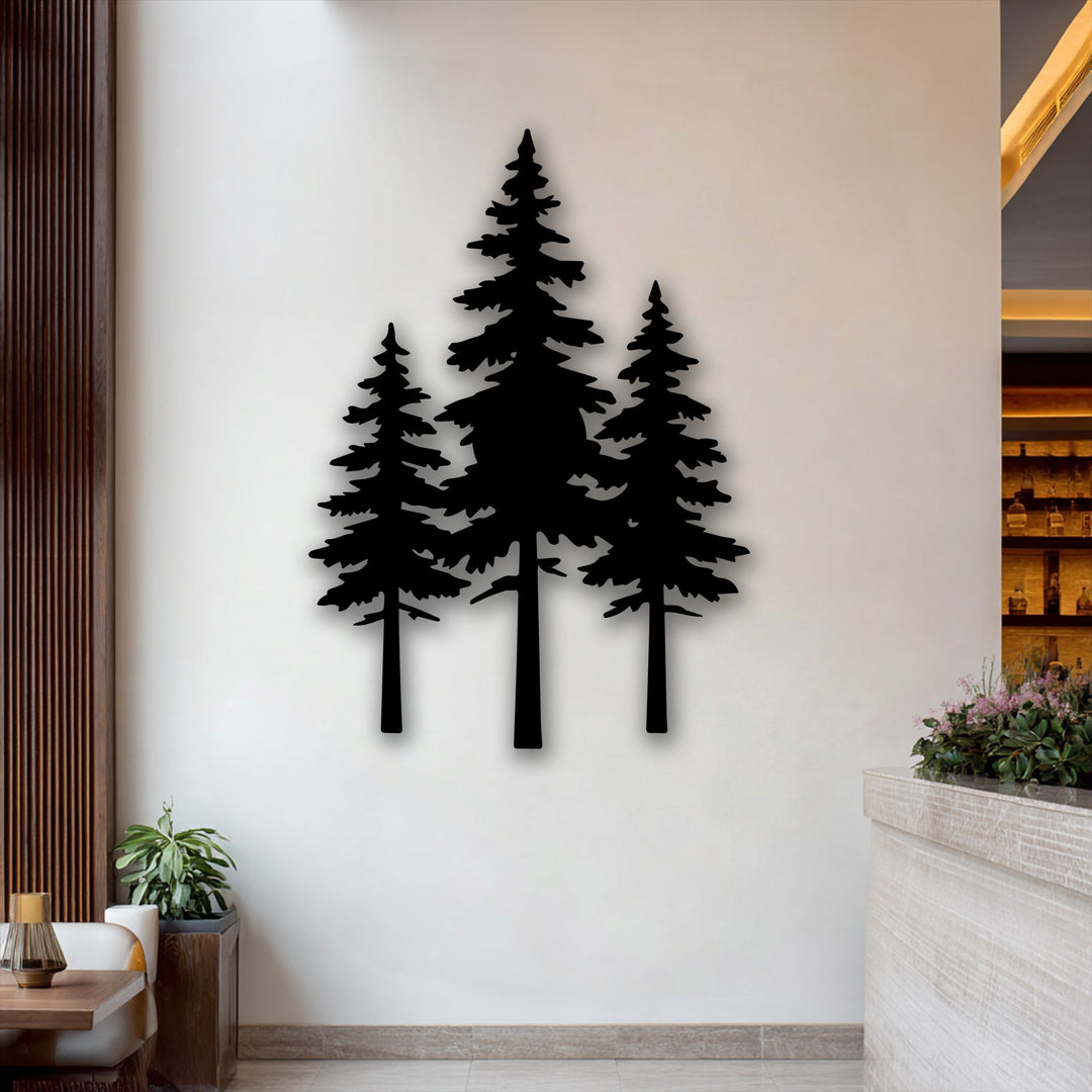 The geometric elements of three striking pine tree silhouettes create minimalist metal artwork against a light wall.