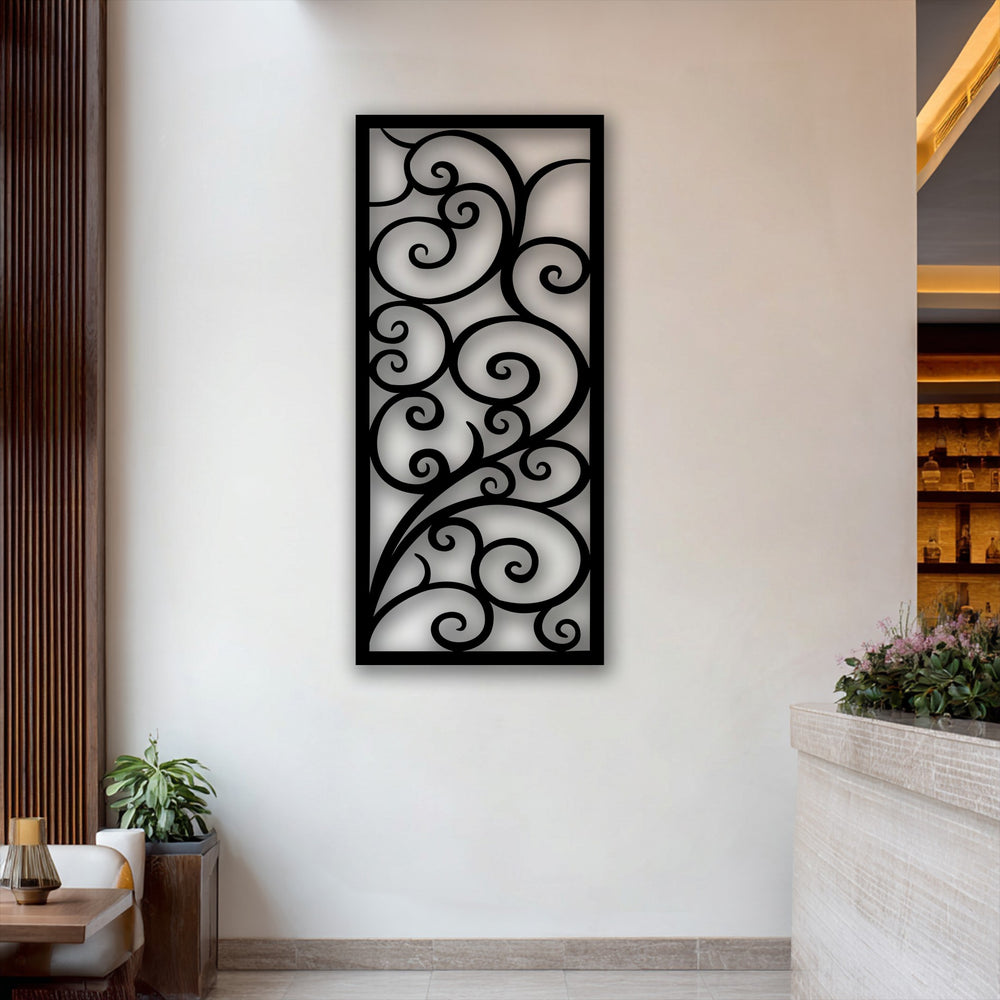 Soft light casts intricate shadows from the elegant scroll pattern metal art for wall, highlighting its flowing vine design against a bright wall.