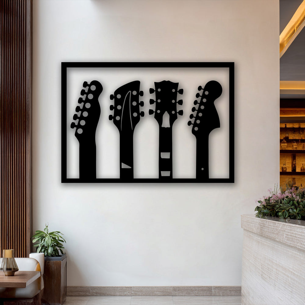 Superior crafted metal wall decor showcasing four distinct guitar headstock silhouettes, ideal for music-inspired interiors.
