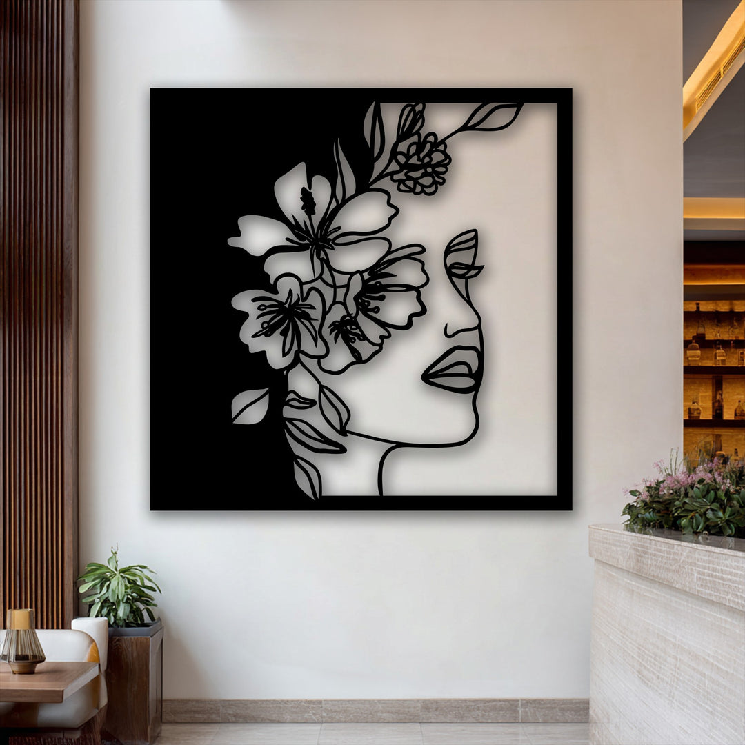 The striking color contrast of the black and white floral woman line art makes a bold statement in this elegant metal art for wall.
