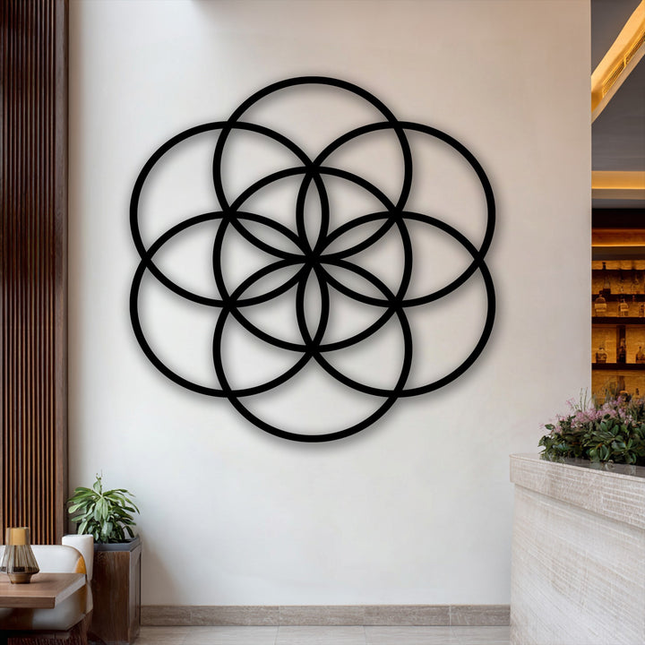 The elegant matte black finish of the Flower of Life geometric metal decoration wall art creates a sophisticated aesthetic.