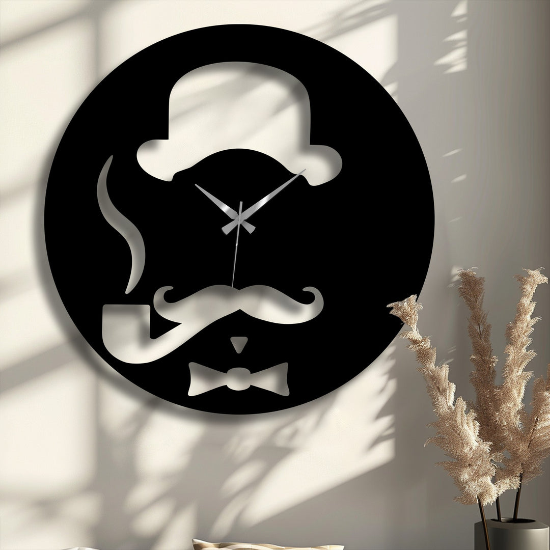 The darkest area, a black silhouette of a gentleman's hat, pipe, mustache, and bow tie, defines this unique metal wall art clock.