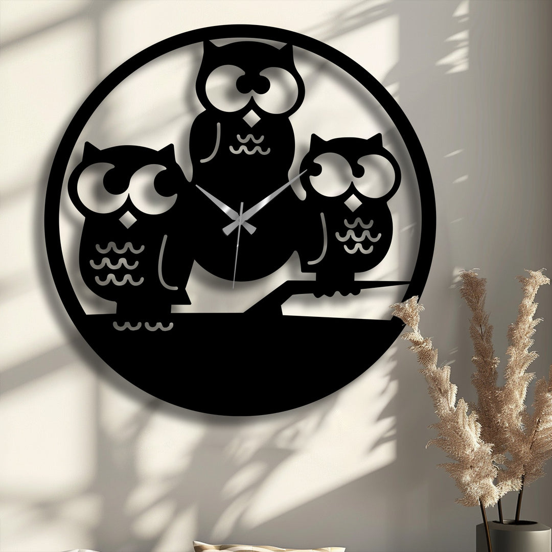 The visual rhythm from the varied owl silhouettes of this metal wall clock forms striking decoration wall art.