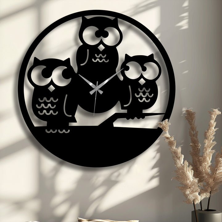 The visual rhythm from the varied owl silhouettes of this metal wall clock forms striking decoration wall art.