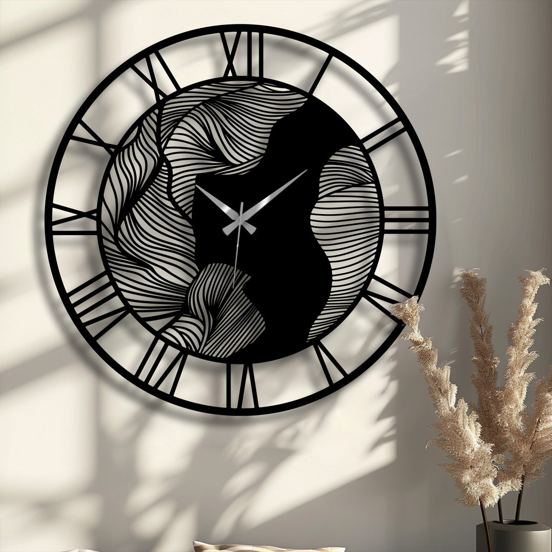 Shadows softly accentuate the intricate, abstract waves of this contemporary metal artwork clock featuring Roman numerals.