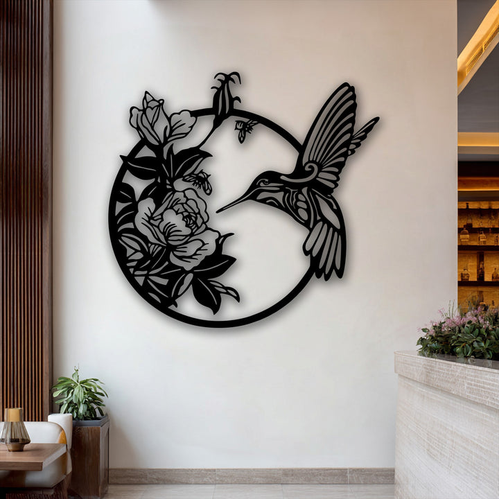 A bright white wall frames the graceful hummingbird metal art for wall, with warm wooden accents and a sophisticated bar setting.