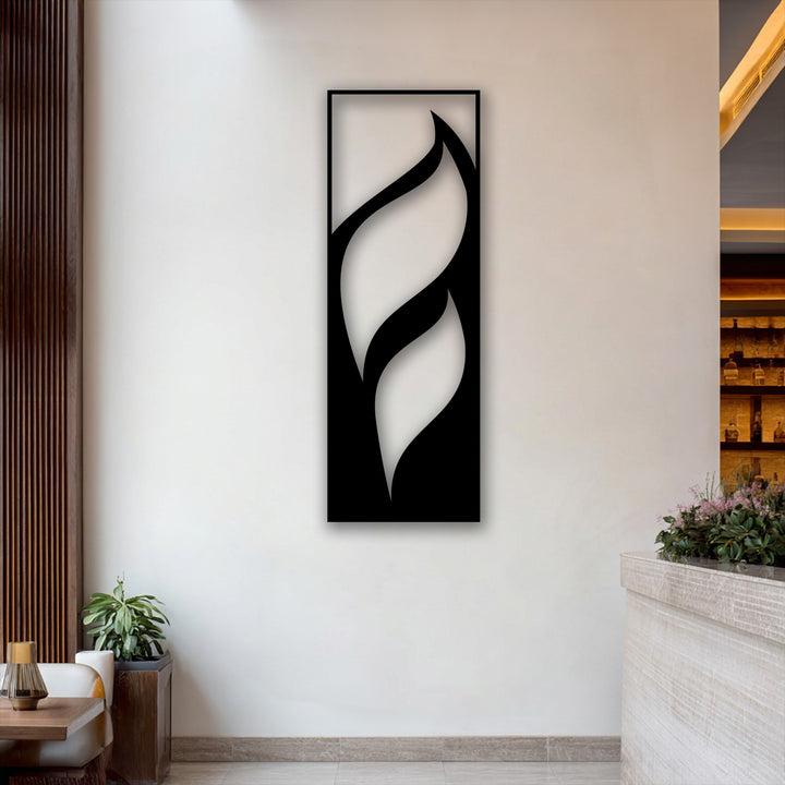 This vertically oriented, rectangular metal wall decor showcases abstract flowing leaf shapes for a minimalist aesthetic.