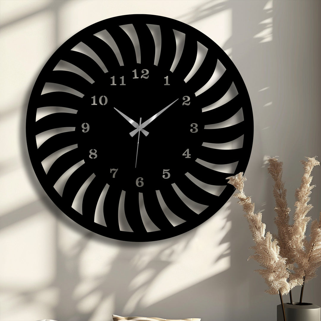 The dynamic visual rhythm of this sleek black radial pattern metal wall clock creates intricate shadows, highlighting its decorative metal art design.