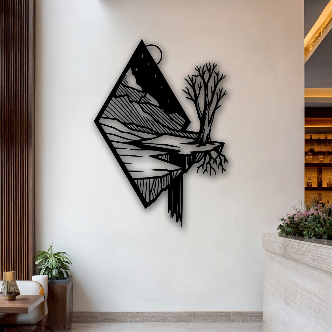 Capturing dynamic movement, this unique metal wall art features a floating mountain landscape with a cascading waterfall and a bare tree.