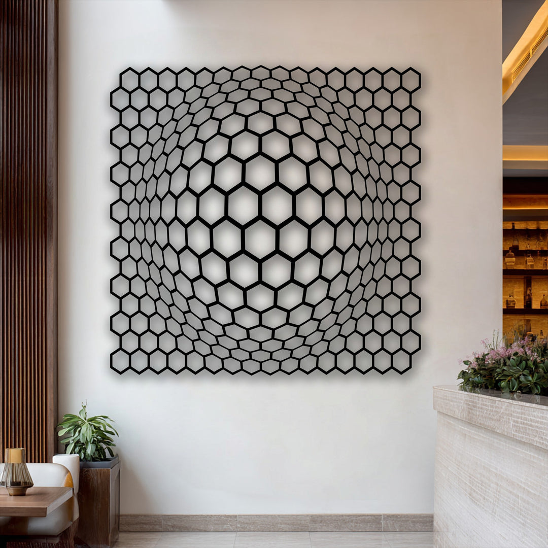 Undulating cellular forms create a captivating hexagon depth illusion in this modern metal artwork, appearing to ripple on the wall.