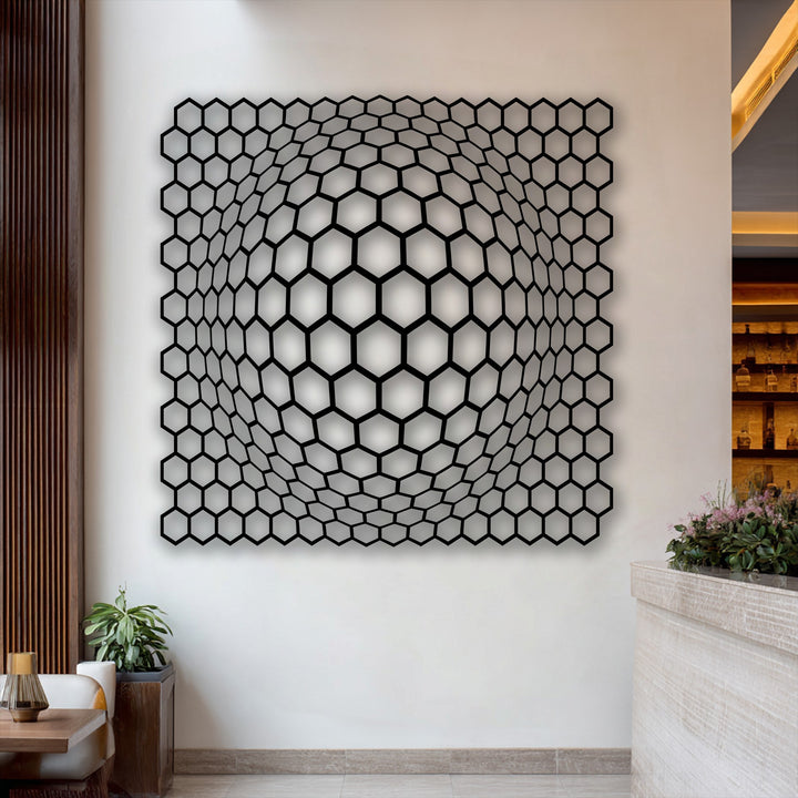 Undulating cellular forms create a captivating hexagon depth illusion in this modern metal artwork, appearing to ripple on the wall.