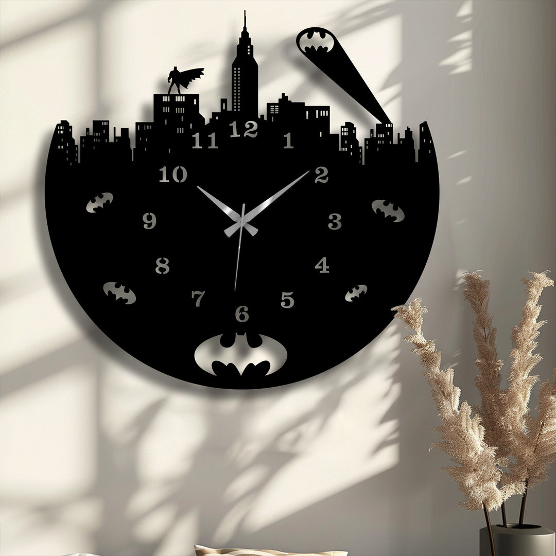 A striking Batman-themed urban night skyline metal artwork wall clock, featuring detailed buildings and a prominent bat signal.