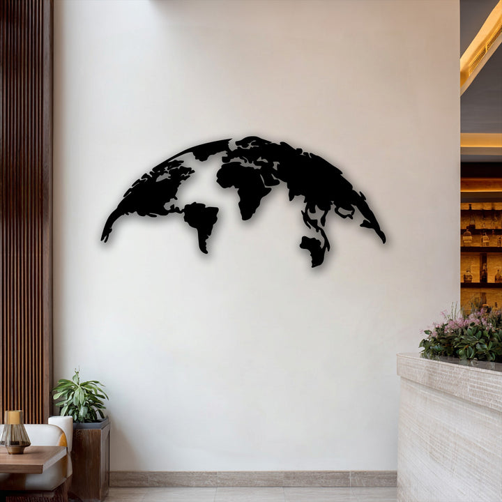 Showcasing realistic detail, this world map decorative metal art features a crisp black silhouette casting a subtle shadow against the bright wall.