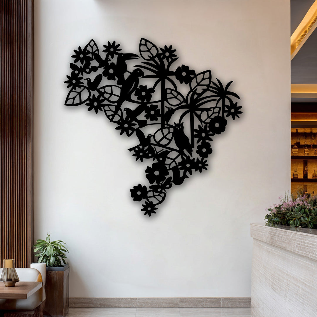 The brightest area highlights the stark white wall, illuminated behind an intricate dark silhouette of floral bird garden decorative metal art.