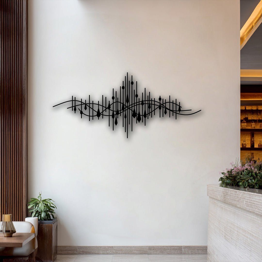 The stillness of the room is accentuated by the dark abstract soundwave line metal artwork, its sleek design frozen on the clean white wall.
