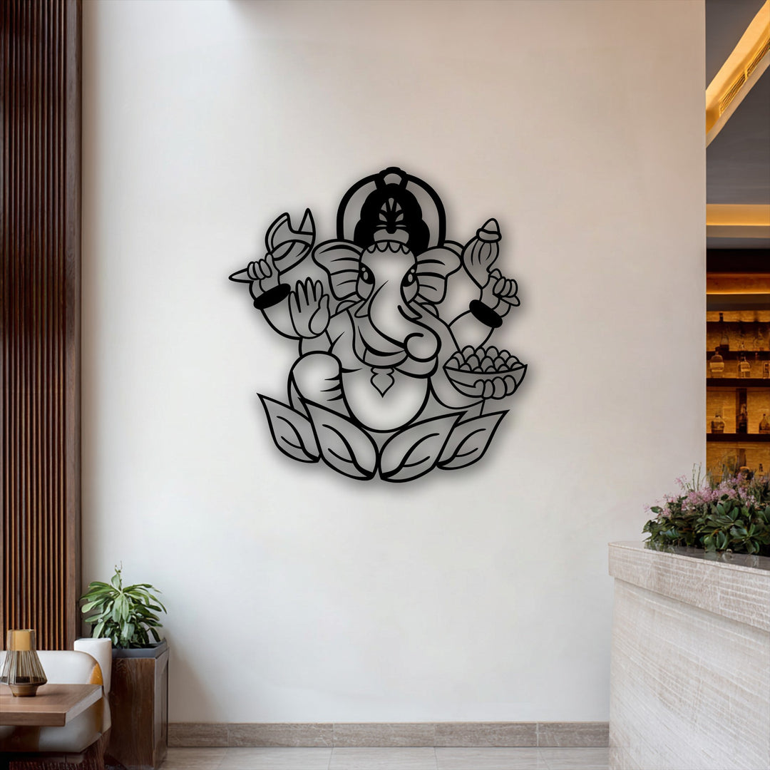 A pristine white wall beautifully adorned with a striking black Ganesha metal artwork, featuring the spiritual elephant deity on a lotus.
