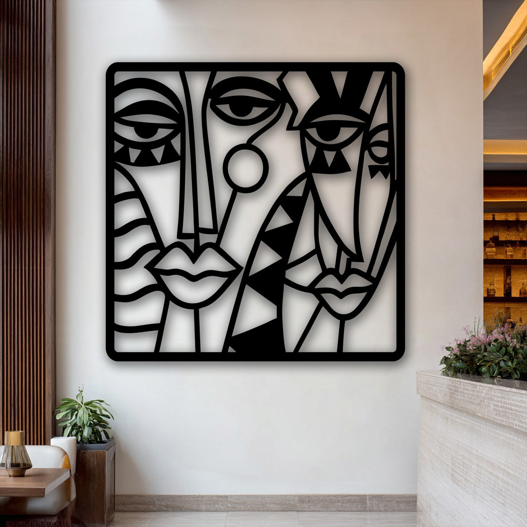 The sleek, clean edges and defined borders of the unique metal wall art create an Abstract Faces Composition, enhancing its modern cubist design.