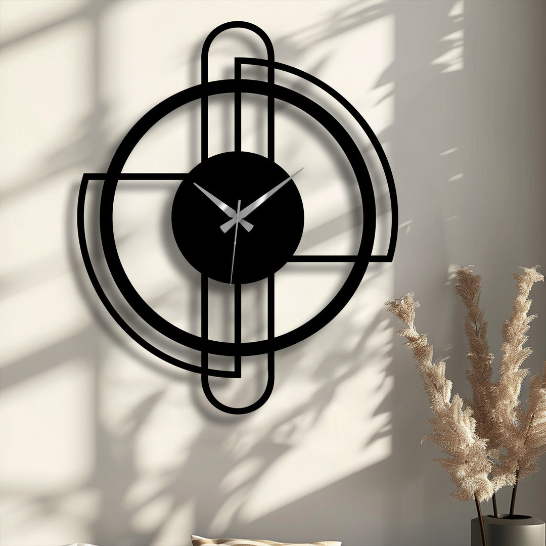 The matte black finish of this modern circular frame decorative metal art clock features a sleek, minimalist line design.