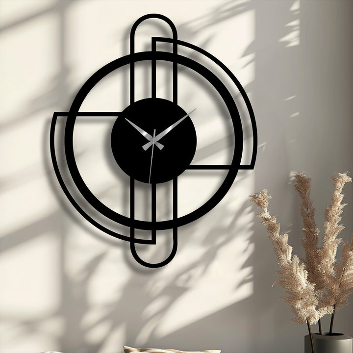 The matte black finish of this modern circular frame decorative metal art clock features a sleek, minimalist line design.