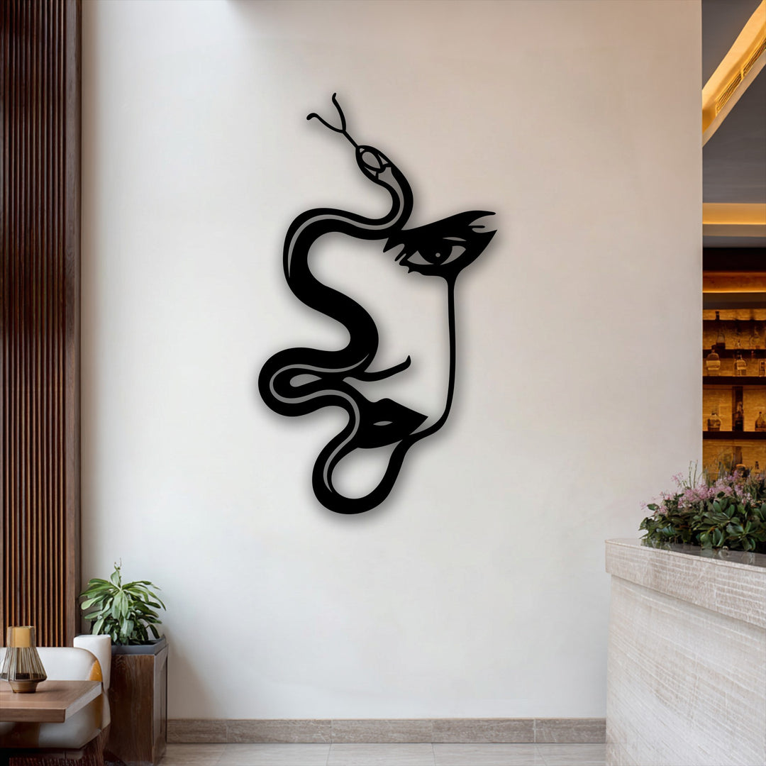 The subdued color saturation highlights the stark black abstract woman and serpent silhouette metal wall decor against muted background elements.