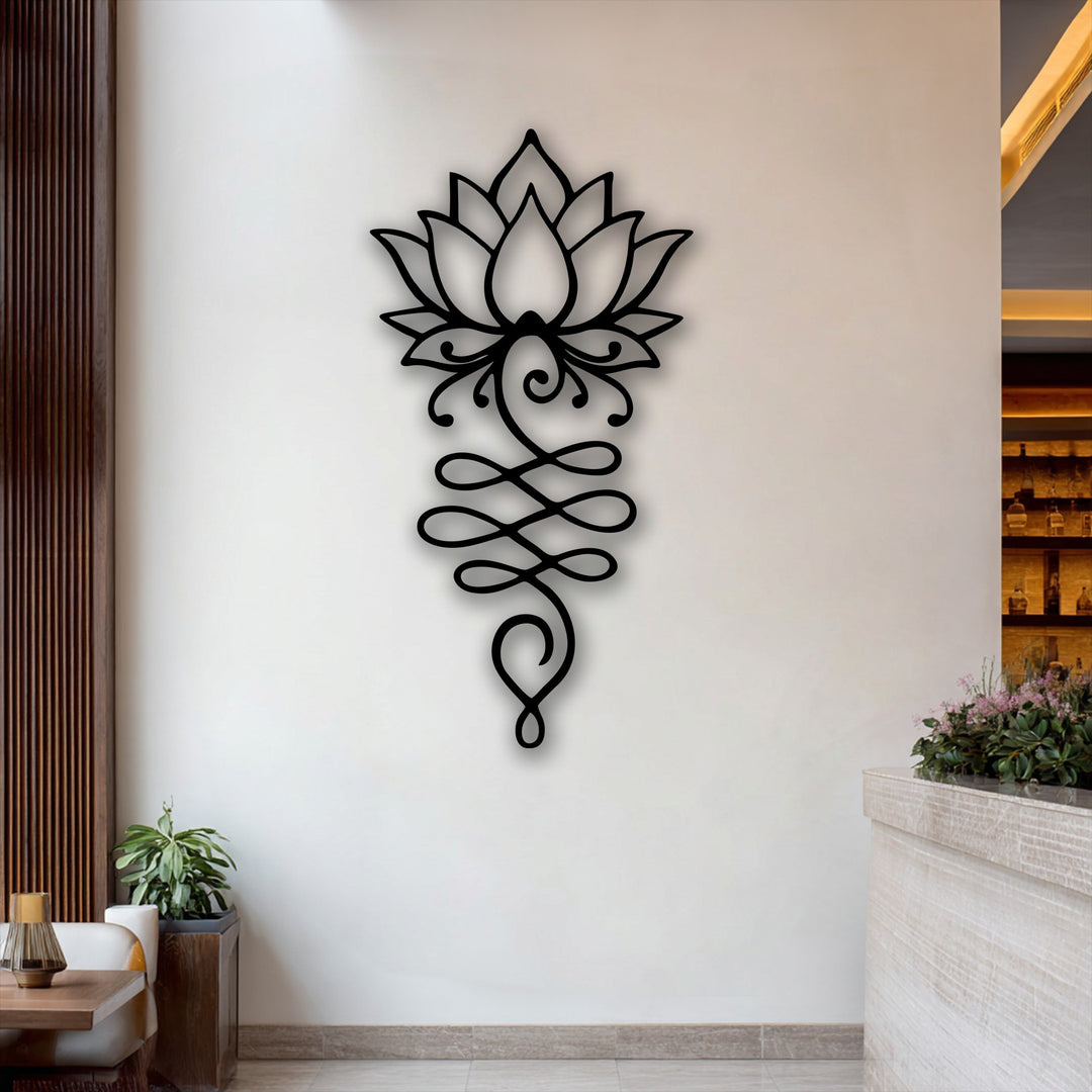 The sleek, matte black surface texture of the intricate Lotus Flower Symbol metal artwork creates a striking visual contrast on the wall.