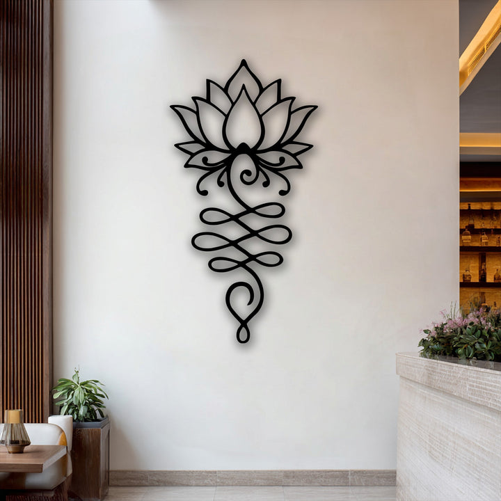 The sleek, matte black surface texture of the intricate Lotus Flower Symbol metal artwork creates a striking visual contrast on the wall.