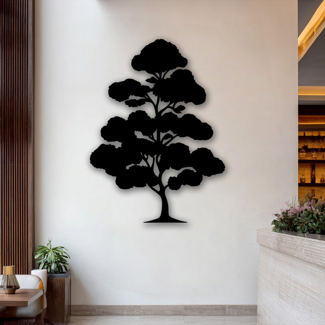 A striking black Zen bonsai tree silhouette, crafted as metal art for wall, stands prominently against a soft cream wall.