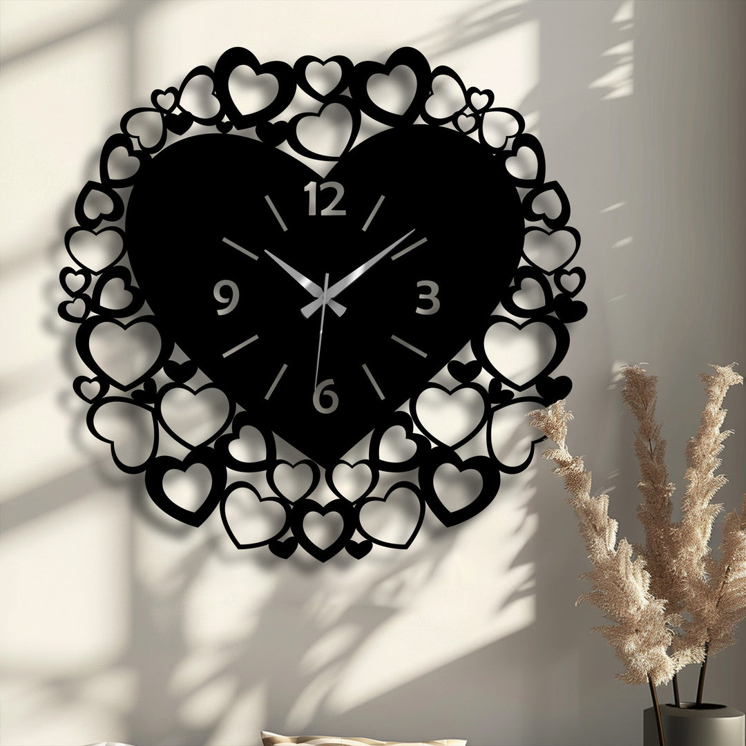 Organic forms of a black heart frame metal wall clock, adorned with countless smaller hearts, create captivating decoration wall art.