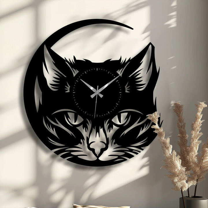 Warm light enhances the sleek black of this mystic fox face metal wall clock, a striking decoration wall art with a modern animal design.