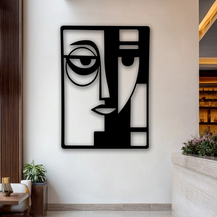The smooth, matte surface texture of the black Abstract Dual Face decorative metal art piece casts distinct shadows, adding depth to its modern geometric design.