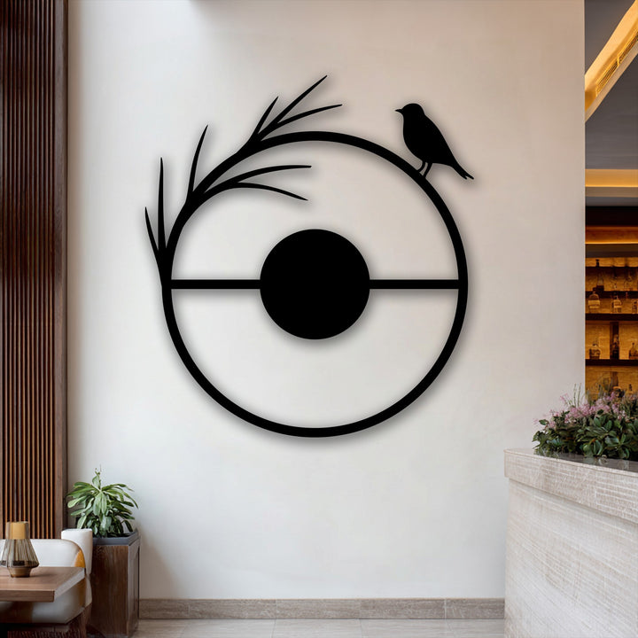 The darkest area, a sleek metal wall decor, forms a minimal bird circle and modern nature silhouette.