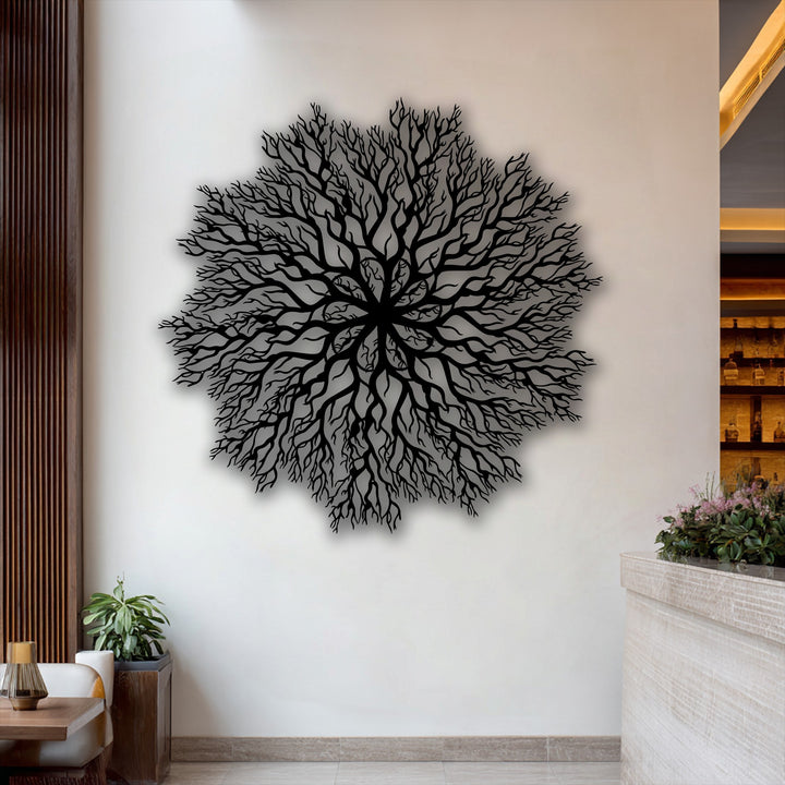 The striking layering effect of the intricate tree roots mandala metal decoration wall art creates depth against the bright wall.