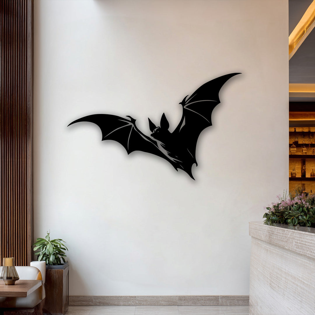 The stark negative space around the Flying Bat Silhouette metal wall decor creates a dramatic Gothic accent against the light wall.