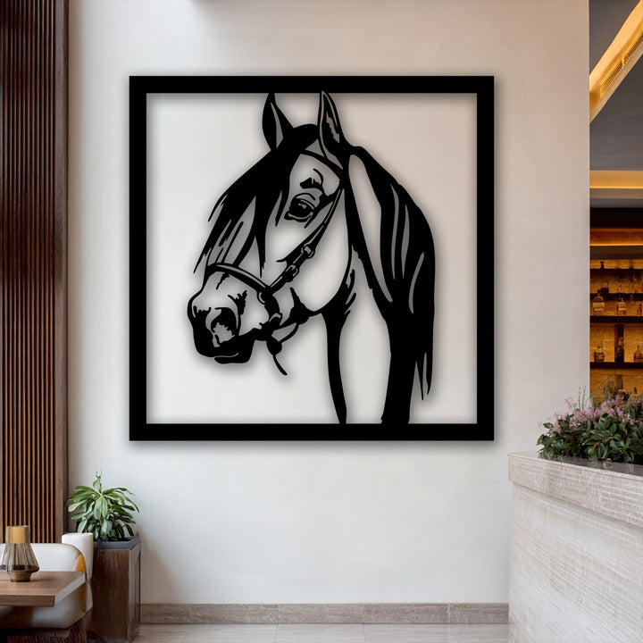 The elegant black decorative metal art stallion portrait creates a striking layering effect with its distinct shadow against the wall.