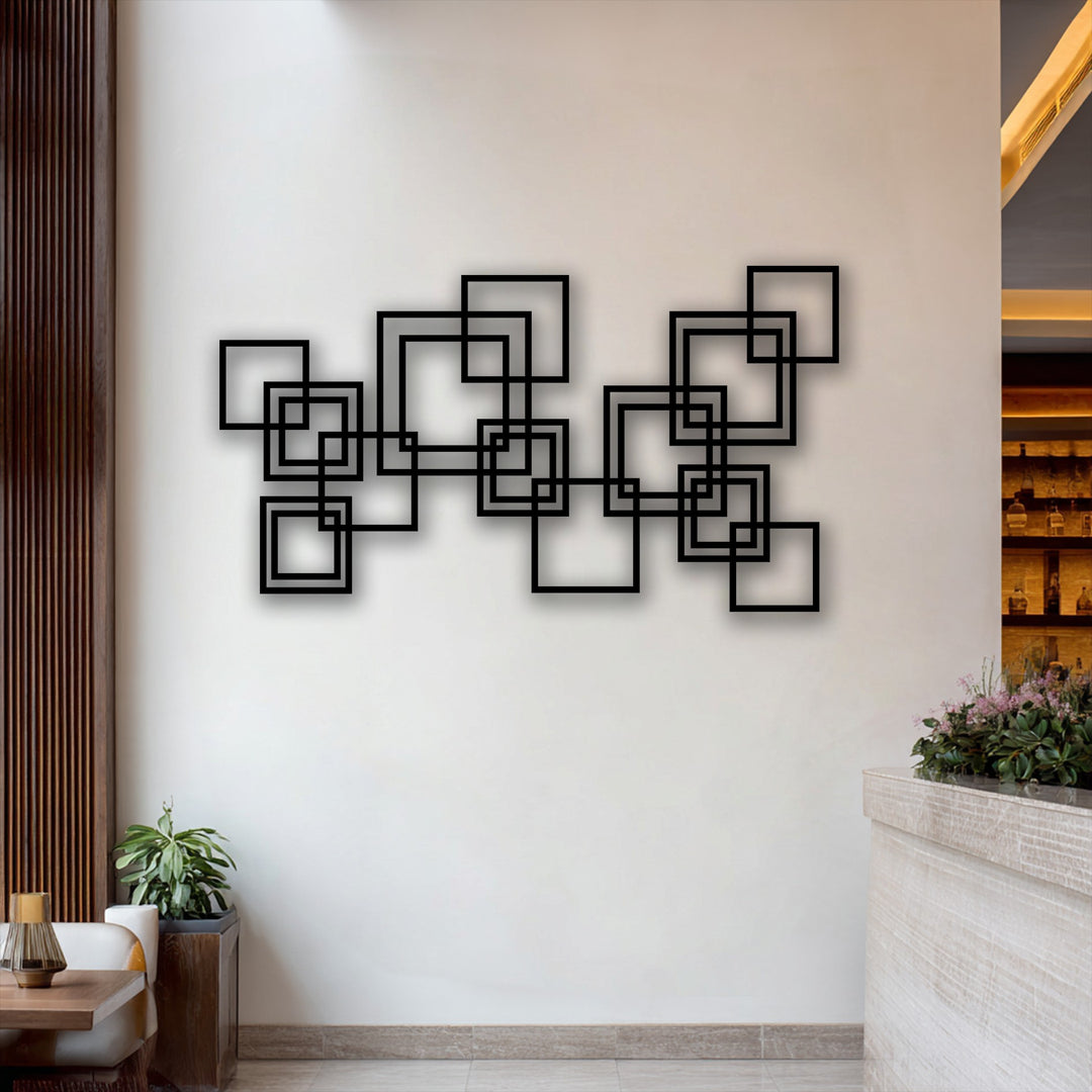 Horizontal and vertical interlocking squares form a striking piece of decorative metal art with a modern geometric design.