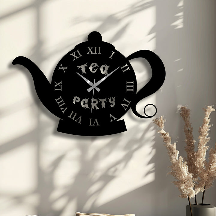 Delicate, feathery plumes of dried decorative plants beautifully complement the distinctive teapot shape metal artwork wall clock with Roman numerals.