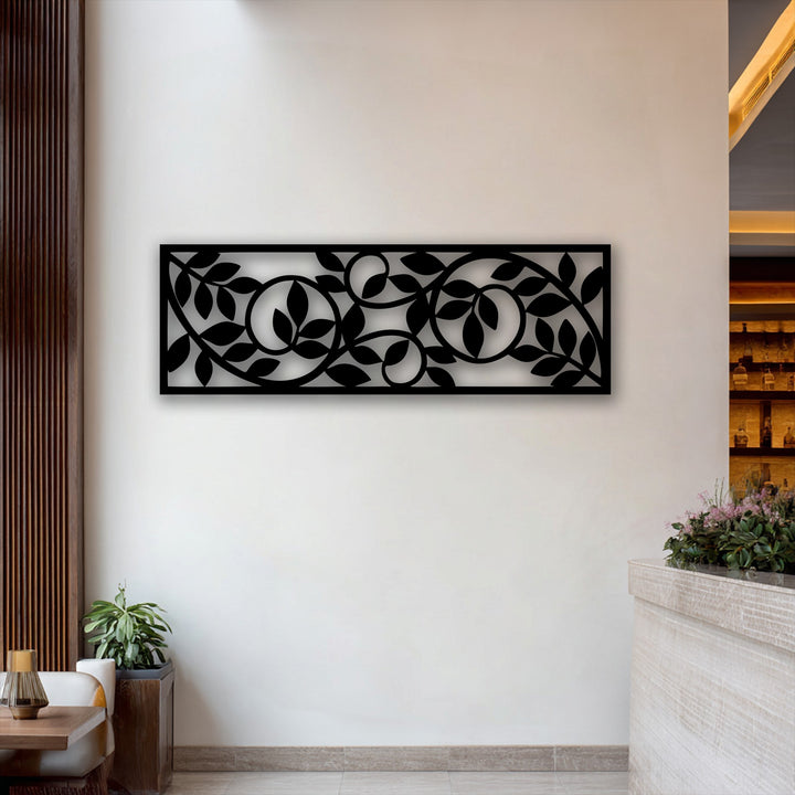 Showcasing realistic detail, this flowing botanical vine metal wall decor features an intricate leaf pattern on a modern horizontal panel.