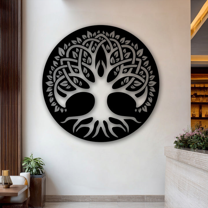 A prominent black circular Celtic Tree of Life metal decoration wall art piece with intricate branches and roots fills the foreground.