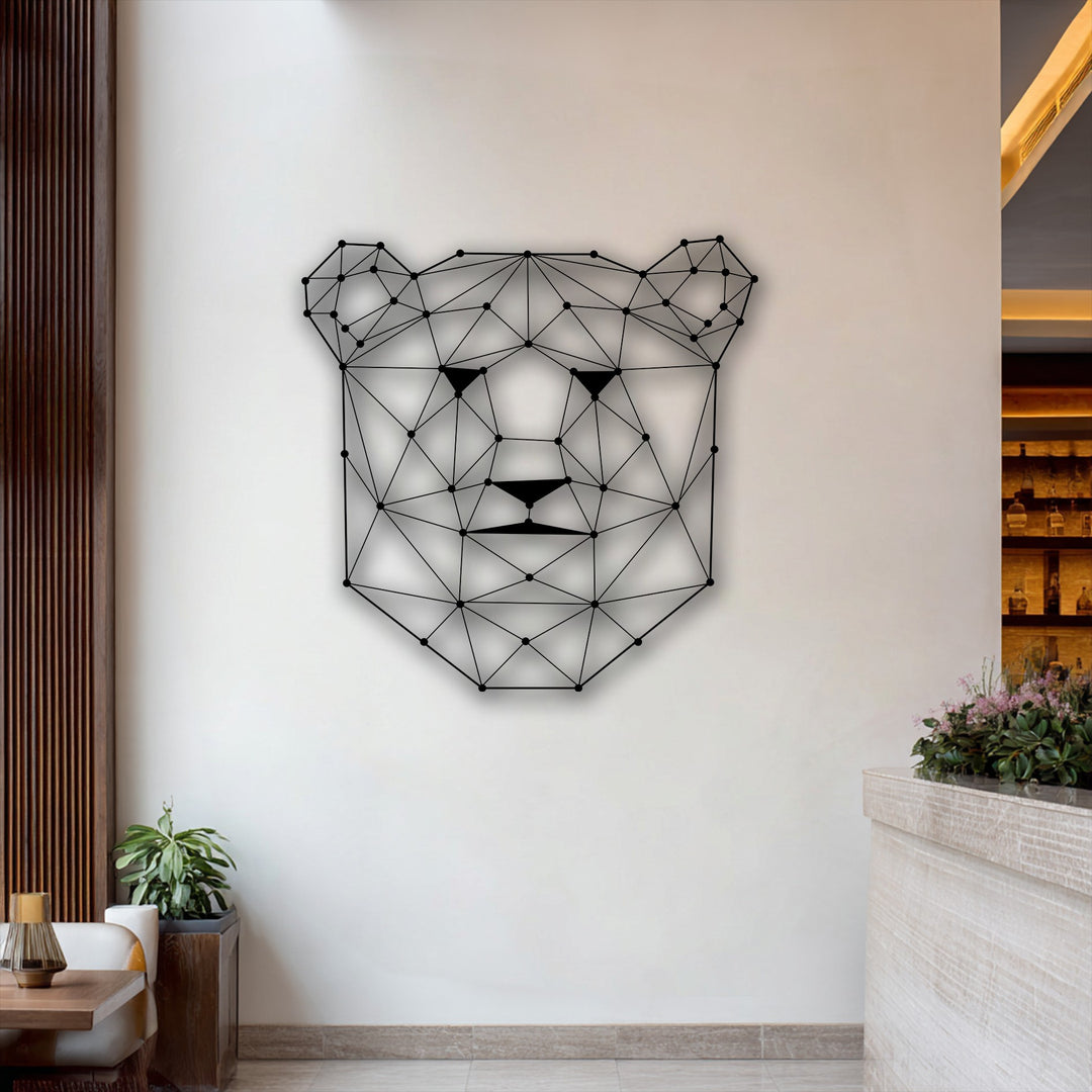 An off-white dominant wall showcases a black geometric bear face metal art for wall, highlighting modern line animal decor.