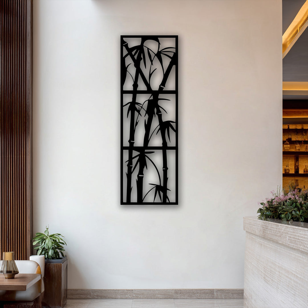 The intricate negative space around the black bamboo metal wall decor beautifully highlights the stark white wall, emphasizing its minimalist nature.