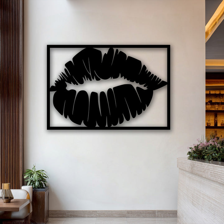 The warm color temperature highlights the striking Bold Kiss Silhouette unique metal wall art on a light wall, surrounded by inviting room elements.