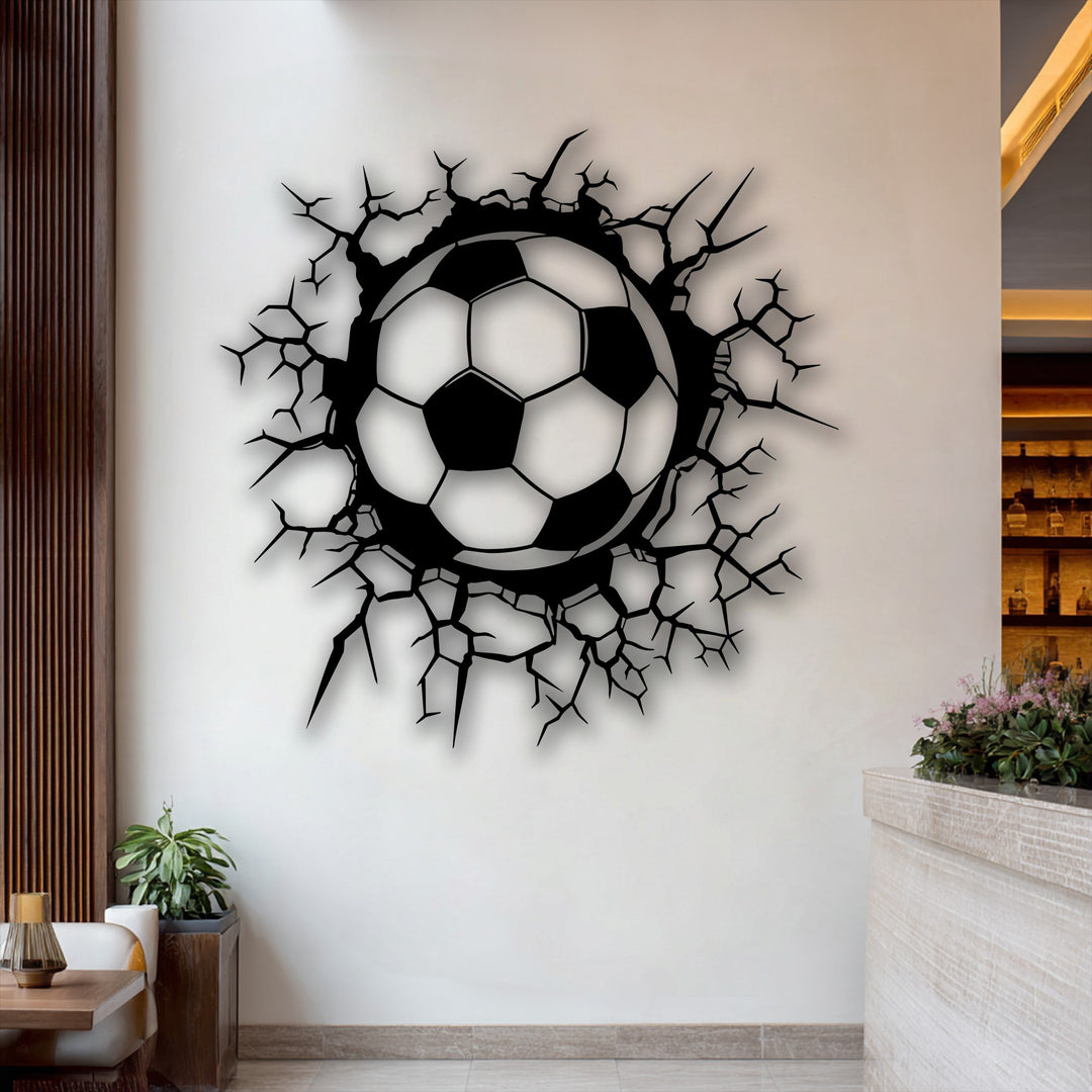 The sleek, matte finish of the breaking wall soccer ball decorative metal art creates a dynamic visual effect on the wall.