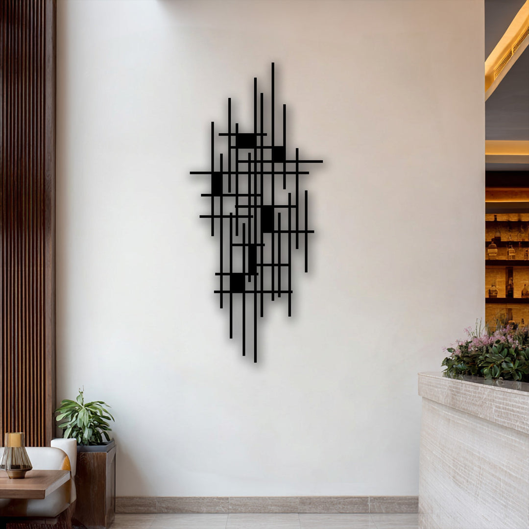 Negative space accentuates the striking geometric grid metal artwork, forming an abstract minimalist design against a clean white wall.