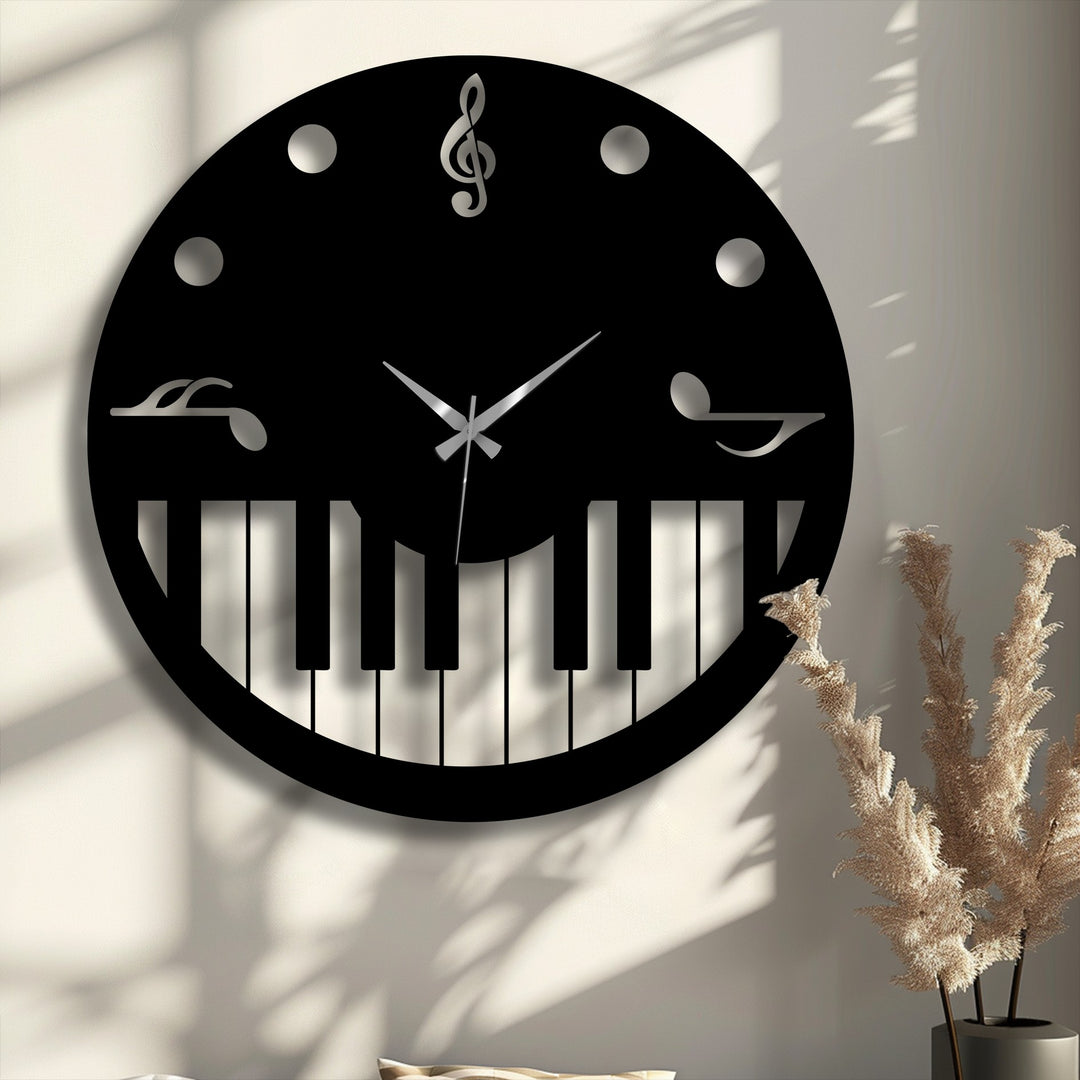 The focal point of the image is a striking black music-themed metal wall decor clock featuring an intricate piano key design and gleaming silver notes.