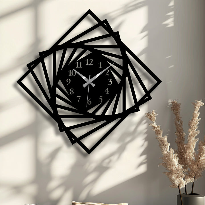 The striking black geometric spiral frame of a modern metal wall clock stands out, offering unique metal wall art.