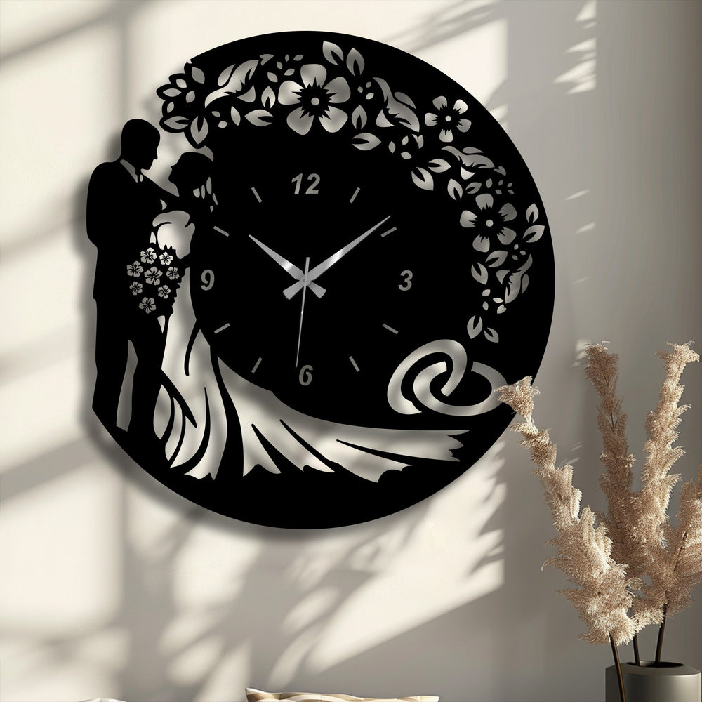 The foreground detail shows a decorative cluster of tall, feathery dried ornamental grass, subtly accentuating the elegant metal artwork.