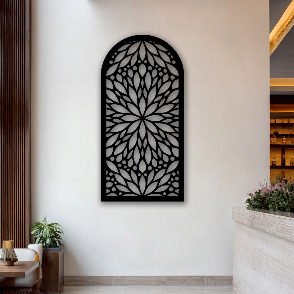 The bright white wall highlights the intricate arch-shaped Sacred Bloom metal wall decor, featuring a striking floral mandala design.