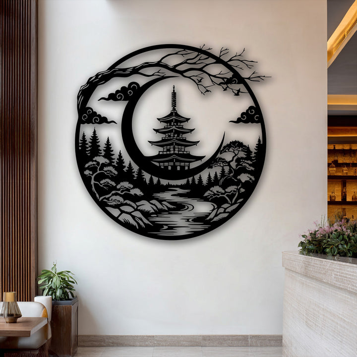 The intricate, laser-cut borders of this circular Japanese Pagoda metal art for wall showcase a serene crescent moon landscape.